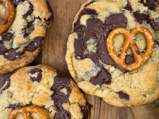 Brown butter chocolate cookies on a wooden board
